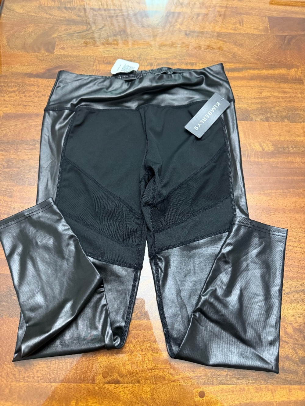 Nwts, Nadine West’s Kimberly activewear shiny faux leather and mesh leggings.
